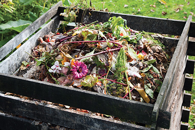 Compost bin in the garden. (© Airborne 77 | Dreamstime.com)